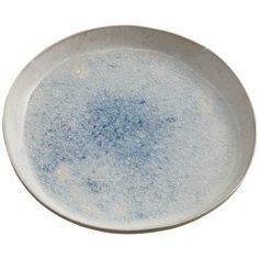 an empty white plate with blue speckles on the rim, isolated against a white background