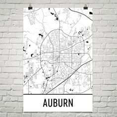 a black and white map of auburn on a brick wall