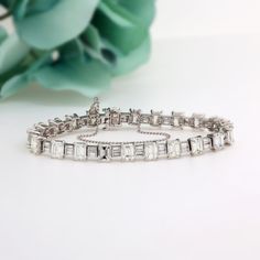 14.50 TW Emerald And Baguette Cut Diamond Tennis Bracelet Platinum 6.75" Estate Metal: Platinum Hallmark: PLA Bracelet Measurements: 6.75" in Length x 6.30 mm in Width & 4.50 mm Thick Weight: 21.2 gr total gram weight Approximately 14.50 TW Diamonds: 22 Prong Set, Natural, Emerald Cut Diamonds, totaling approximately 13.50 TW  Diamond Quality: G-I color; VVS-SI1 clarity Diamonds: 22 Prong Set, Natural, Baguette Cut Diamonds, totaling approximately 1.00 TW  Diamond Quality: G-I color; VVS-SI1 cla Bracelet Measurements, Diamond Tennis Bracelet, Delray Beach, Box Clasp, Baguette Cut Diamond, Tennis Bracelet Diamond, Baguette Cut, Emerald Cut Diamonds, Natural Emerald