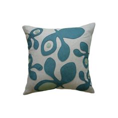 a blue and white pillow with an abstract design