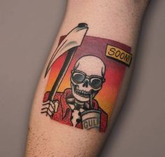 a man with a tattoo on his arm holding an umbrella and skull in front of him