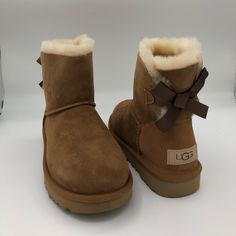 Reposhing This Item I Purchased From @Melodyforlife. Loved It, But Too Big For My Daughter. Questions? Leave A Comment Below! Ugg Mini Bailey Bow, Brown Uggs, Cute Uggs, Ugg Mini Bailey, Mini Baileys, Ugg Mini, Shoes Ugg, Bailey Bow, Ugg Slippers