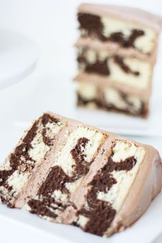 two slices of cake sitting on top of a white plate