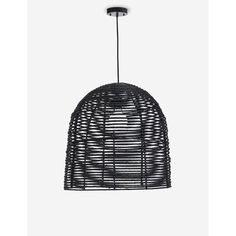 a black rattan light hanging from the ceiling with an iron wire structure on it