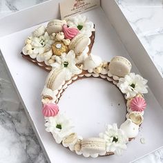 a white box with some flowers and seashells on it