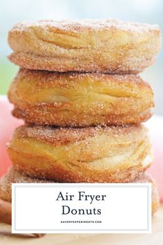 four ingredient air fryer donuts stacked on top of each other with cinnamon sticks