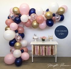 balloons and streamers are arranged in the shape of an o - letter for a party