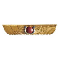 an egyptian winged badge with a scar on it's wings and a red stone in the center