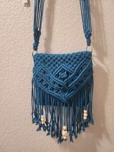 "This is a handmade macrame unique cross-body bag that features a Josephine knot. This one has fringe, beads and unique knots to create this beautiful pattern! Each purse purchase comes with a FREE zipper pouch to carry inside! This bag is made with 3mm cotton 3-ply twisted cord.   The dimensions of this bag are: 8.5\" wide 8.5\" pouch height 14\" from top to end of fringe Strap drop is 27\"  IMPORTANT: Due to the nature of handmade items the finished product may vary slightly from pictures. Thank you for supporting our small business!" Handmade Bohemian Shoulder Bag With Adjustable Strap, Bohemian Handmade Adjustable Shoulder Bag, Bohemian Macrame Bags As Gift, Macrame Crossbody Bag, Macrame Unique, Josephine Knot, Beads Bag, Accessories Beads, Purse Handmade