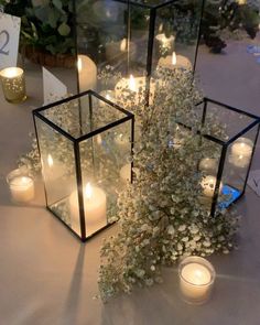 candles and flowers are sitting on the table