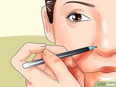 a woman is holding a pen to her face