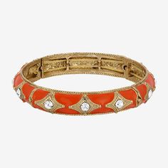 Discover a whole new hue with this stunning stretch bracelet from our 2028 collection. The color makes a bold impact with tantalizing orange tangerine that is hand-enameled, contrasting against an exotic Indonesian motif of polished gold and striking white crystals.Bead Type: EnamelFeatures: StretchCircumference: 7 InchMetal Color: Gold ToneCare: Wipe CleanBracelet Type: Stretch BraceletsMetal: AlloyIs Beaded: NoCountry of Origin: Imported Elegant Adjustable Orange Bangle, Adjustable Orange Stretch Bracelet, Elegant Orange Bangle Bracelet, Orange Bangle Bracelets For Party, Orange Bangle Stretch Bracelet For Gift, 1928 Jewelry, White Crystals, Vintage Fits, Stretch Bracelet