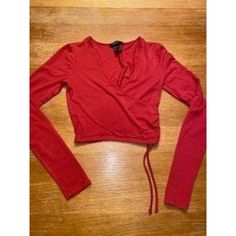 Womens Forever 21 Crop Top Size-Small Condition- New Without Tags Features-95% Rayon, 5% Spandex, 23" Sleeves, Drawstring Side On The Left, Criss Cross Front, 14" Long, 13.5" Pit To Pit (128) Red Elastane Tops For Spring, Fall Red Elastane Tops, Red Fitted Crop Top For Spring, Red Fitted Crop Top For Fall, Fitted Red Crop Top For Fall, Forever 21 Trendy Red Crop Top, Red Stretch Top By Forever 21, Red Stretch Top From Forever 21, Fitted Cotton Crop Top By Forever 21