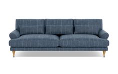 a blue couch sitting on top of a white floor