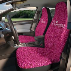 the interior of a car with pink seat covers