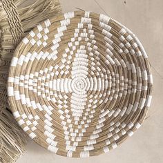 a woven basket sitting on top of a table