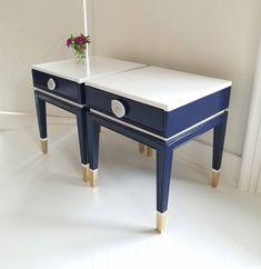 two blue and white tables with flowers on them