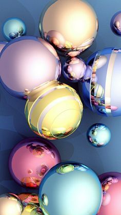 an array of colorful balls floating on top of each other in the air with reflections from them