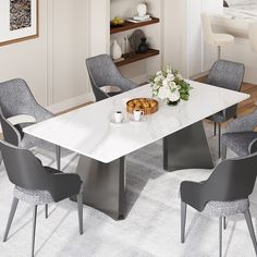 a dining table with chairs around it and a bowl of food on the table next to it