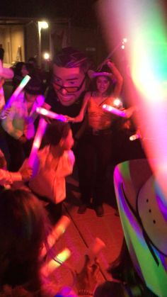 a group of people dancing at a party