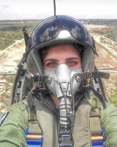 a man wearing a pilot's helmet and goggles