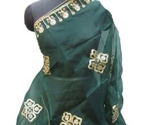 Pattern - an embroidered scarf. Ideal for - women/ girls. Occasion - formal or casual. Ideal for functions or parties. Fabric - organza silk, has a fine texture with a nice fall. Color - green, on green background floral embroidery, is with golden gota thread. Size - 36 x 88 inches approx. Can be wrapped in different styles. Care - gentle hand wash. For more such scarves please visit- For more such scarves For all orders, $120 and above, it will be express delivery through DHL confirmed delivery Embroidered Green Shawl Dupatta, Green Embroidered Shawl Dupatta, Green Shawl With Resham Embroidery In Traditional Drape, Elegant Green Embroidered Shawl, Green Embroidered Dupatta Shawl, Party Dupatta With Embroidered Border And Tissue Silk, Party Dupatta With Embroidered Border In Tissue Silk, Embroidered Green Shawl For Eid, Green Embroidered Shawl For Eid