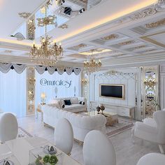 a living room filled with white furniture and chandeliers