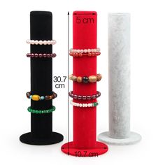 three different bracelets are on display in front of a white pillar and the measurements for each