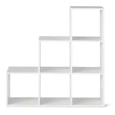 a white shelving unit with four shelves on each side and one shelf in the middle