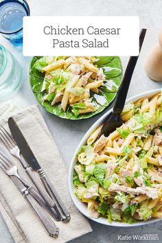 chicken caesar pasta salad with lettuce in a bowl and two forks on the side