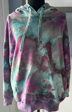 Hand Dyed Ice dyed Women's hoodie with side pockets.  Please see size chart for proper fit. **NO EXCHANGES OR REFUNDS FOR SIZING ISSUES** Hand Dyed Hoodie For Spring, Tie Dye Washed Long Sleeve Hoodie, Tie Dye Relaxed Fit Hoodie, Long Sleeve Tie Dye Washed Hoodie, Oversized Tie-dye Hoodie, Relaxed Fit Tie Dye Hoodie, Tie Dye Hoodie Sweatshirt With Drawstring, Acid Wash Hand Dyed Hooded Hoodie, Tie Dye Hoodie With Drawstring Hood