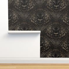 a wall with a tiger pattern on it and a wooden floor in front of it