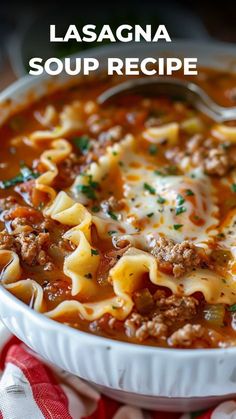 a bowl of lasagna soup with meat and noodles in it on a red and white napkin