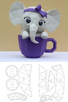 an origami elephant sitting in a cup