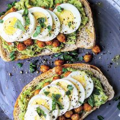 two pieces of bread with eggs and avocado on them