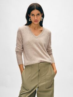 The ultimate relaxed-but-still-polished sweater, the Cashmere V Neck is a wardrobe staple that you'll love to live in. It’s spun from soft, lightweight cashmere for a straight fit with a flattering V-neckline and neatly ribbed trim. The minimal styling will make a great pairing with a high-waisted skirt or wide-leg jean. Details Straight fit. Long sleeve. Length in size small is 23" The model is 5'10 1/2" and is wearing a size small. 100% Cashmere. Hand wash cold or dry clean. Do not twist or wr Cashmere Travel Wrap, Cardigan Top, Sweater Sale, Knitwear Cardigan, Fall Shopping, Heather Black, Cashmere Sweaters, Wardrobe Staples, Leg Jeans