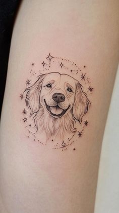 a dog's head with stars around it on the side of a woman's thigh