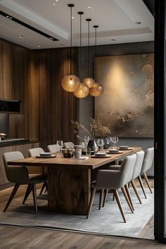 a dining room table surrounded by chairs and lights