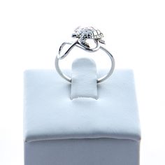 "Sterling Silver Infinity Sea Turtle Ring A cute sterling silver Sea Turtle mounted on a smooth round infinity band. We do set him slightly on the diagonal, to give the appearance of swimming across your knuckles :) The turtle measures about 1/4 an inch. We package this lovely ring in a white gift box. This ring is handmade in our studio, so multiple ring sizes are available. Don't know your ring size? https://etsy.me/2vFkxk9 Are you new to Etsy? Shop my store and add your favorite items from Th Silver Infinity Stackable Rings, Silver Infinity Stackable Jewelry, Sterling Silver Stackable Infinity Jewelry, Silver Stackable Infinity Jewelry, Adjustable Infinity Stackable Rings For Anniversary, Sterling Silver Infinity Stackable Rings, Adjustable Infinity Stackable Anniversary Rings, Adjustable Infinity Stackable Rings Gift, Adjustable Infinity Sterling Silver Rings