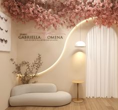 a living room filled with furniture and pink flowers on the ceiling over it's windows