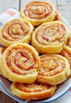 a plate filled with pastries sitting on top of a table