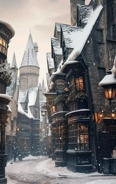 the wizard's house is surrounded by snow and lights in front of other buildings