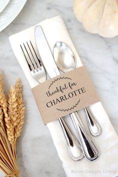 there is a fork and spoon on the table with a card that says thank you charlotte