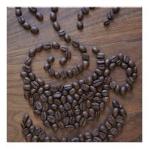 coffee beans are arranged in the shape of a monkey's face on a wooden surface