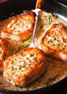 pork chops with gravy in a skillet