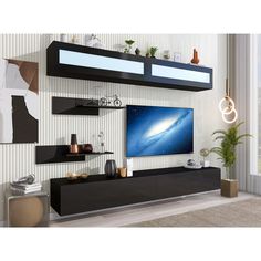 a living room with a large flat screen tv mounted on it's side wall