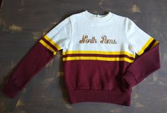 Vintage Varsity sweater Band, cheerleader, baton twirler etc. Brand is Spirit Fashions Memphis TN 100% acrylic Burgundy, yellow and cream Size is 36 Bust but please go by measurements in photos as sizing in vintage clothing can be tricky In overall very good clean condition Please study photos for added description and measurements Thank you for visiting MidWestMerc! White Collegiate Winter Sweater, Sweater Uniform, Varsity Cheer, High School Cheer, School Sweater, Varsity Sweatshirt, Vintage Varsity, Varsity Sweater, Cheer Shirts