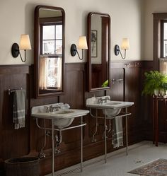 a bathroom with two sinks and mirrors in it