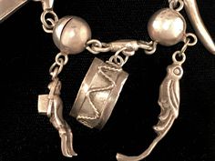 "Vintage Mexican sterling silver bracelet with Peruvian/South American style charms and silver balls, circa 1940s. Bracelet is 6 1/2\" long, with silver ball design and 9 charms ranging in size from 1/2\" to 1 1/2\" long. The charms include a drum, parrot, banana, person with basket, a coffee/cocoa bean, and other symbols. The bracelet has a box clasp with \"Hecho en Mexico\" stamped on the back. We ship with USPS, insured for the full value of the item." Vintage Silver Bracelets With Dangling Charms, Vintage Sterling Silver Bracelet With Charm, Heirloom Silver Bracelet With Vintage Charm, Vintage Sterling Silver Charm Bracelet With Dangling Charms, Antique Sterling Silver Charm Bracelets, Antique Sterling Silver Bracelets With Charms, Vintage Silver Bracelet With Silver Beads, Vintage Sterling Silver Bracelet With Dangling Charms, Sterling Silver Bracelet With Vintage Charm