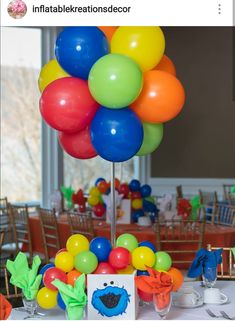 there is a table with balloons on it